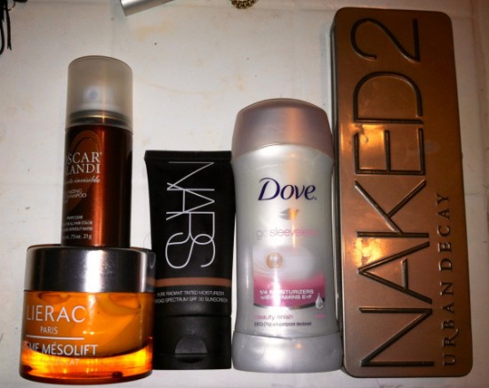 A variety of beauty products on a counter, perfect for beauty on the go.