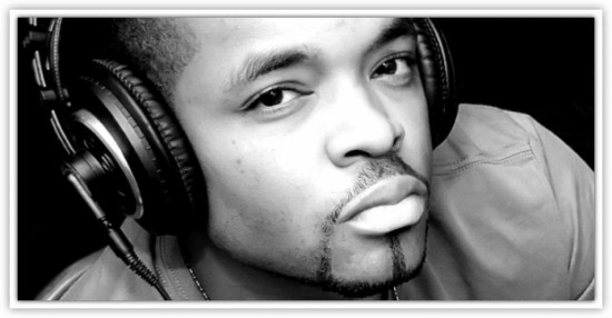 A black and white photo of a man wearing headphones.