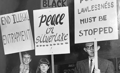 A group of people holding signs that say peace, laws, and silver lake.