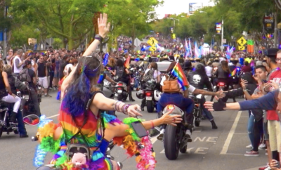 Lots of people are on the bikes pride parade.