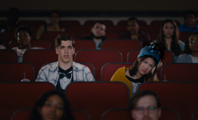 A group of people sitting in an auditorium.
